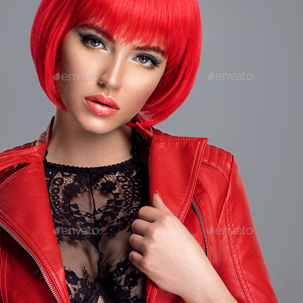 Beautiful sexy woman with bright red bob hairstyle. Fashion model